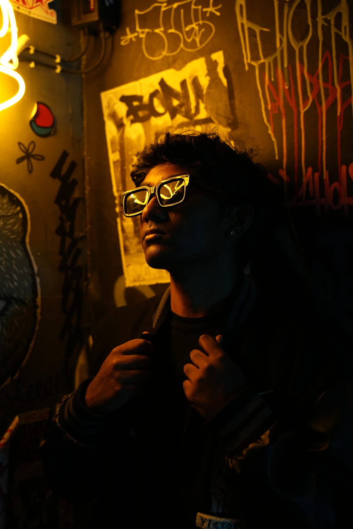 RYKARA in a graffiti-lined room, press portrait 04
